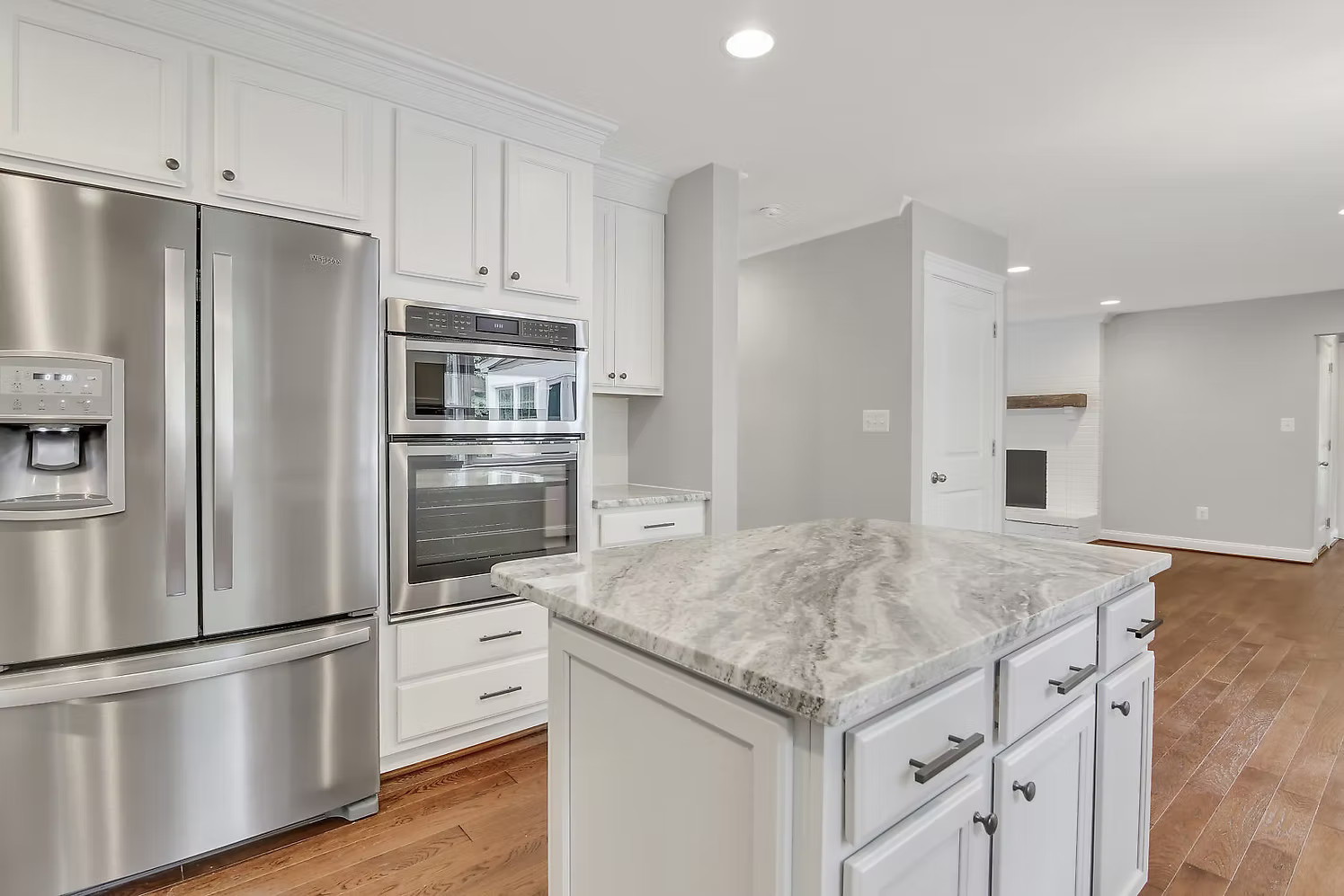 Kitchen with stainless appliances and marble island