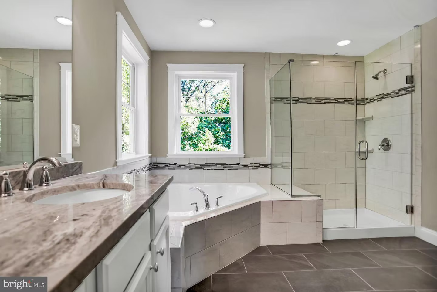 Master bathroom with soaking tub and glass shower